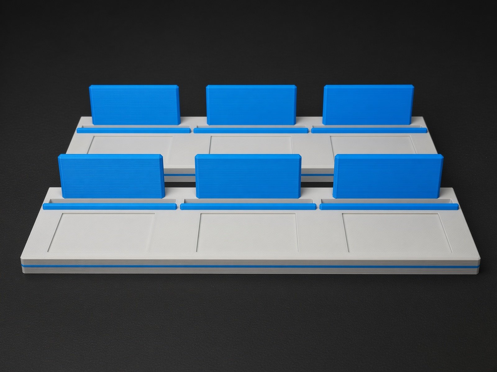 The 3 Slab PSA Card Display Stand in light gray with blue accents